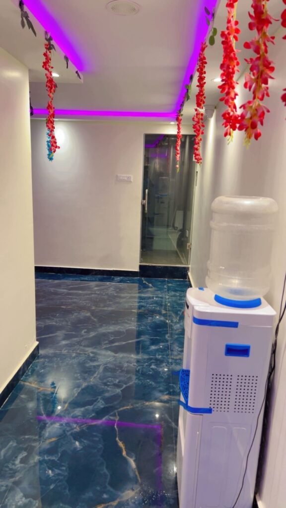 Interior corridor with floral decorations at Anu Wellness Studio in Ameerpet